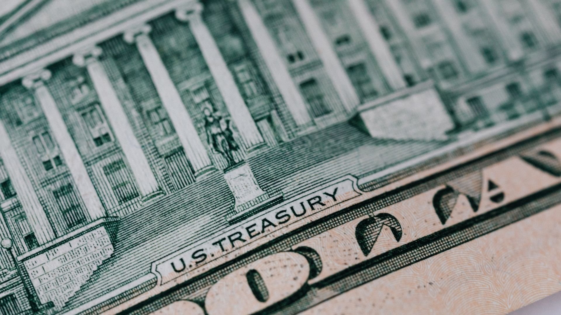 Close-up of U.S. Treasury text on a detailed dollar bill